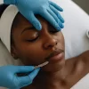 Dermaplaning in Orlando with mask and light therapy